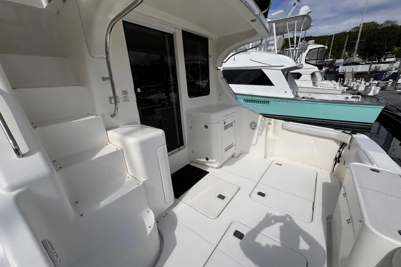 Slide: The Image of 2004 Silverton 38 Convertible yacht deck with stairs and storage compartments. - 29