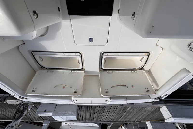 Slide: The Image of 2004 Silverton 38 Convertible boat storage compartments, open view from above. - 30