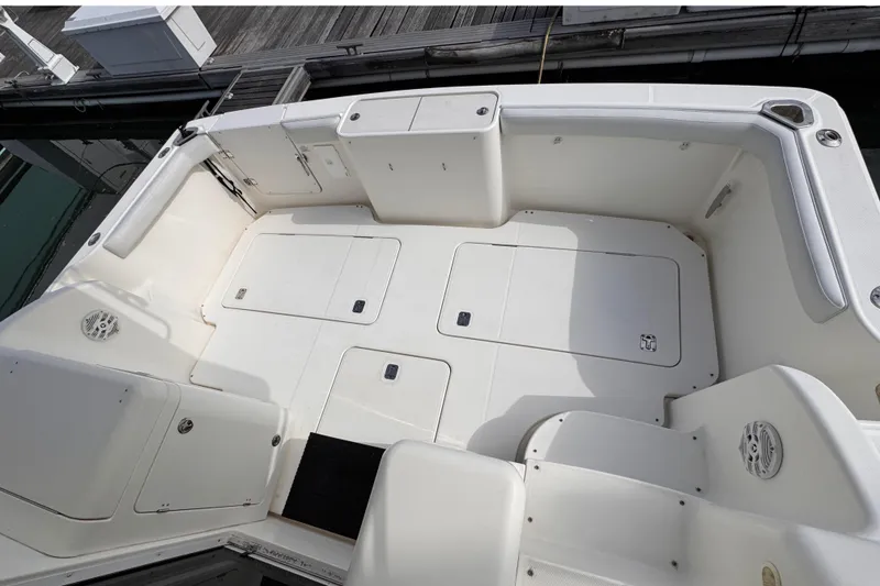Slide: The Image of 2004 Silverton 38 Convertible boat deck with storage compartments and seating. - 33