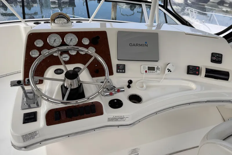 Slide: The Image of 2004 Silverton 38 Convertible boat helm with Garmin navigation system and control panel. - 38