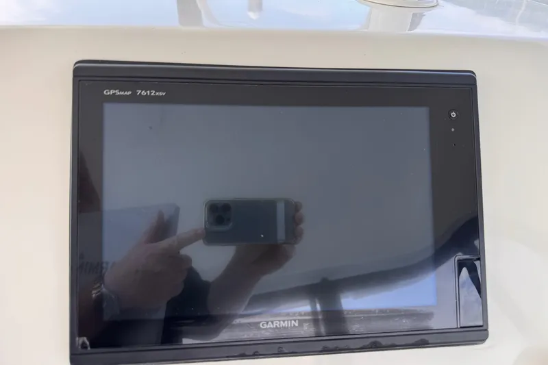 Slide: The Image of Garmin GPSmap 7612xsv on 2004 Silverton 38 Convertible boat dashboard. - 40