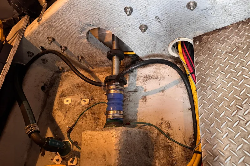 Slide: The Image of Engine compartment of a 2004 Silverton 38 Convertible boat, showing wiring and plumbing. - 47