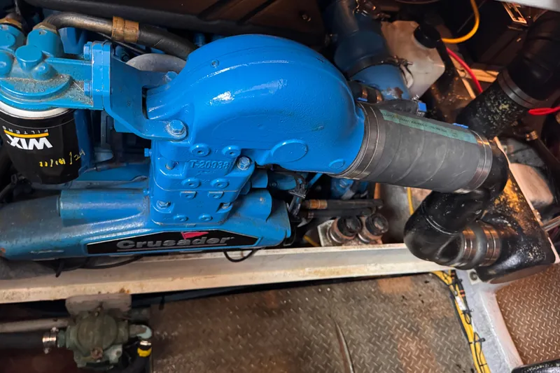 Slide: The Image of Engine compartment of a 2004 Silverton 38 Convertible boat with Crusader engine. - 49