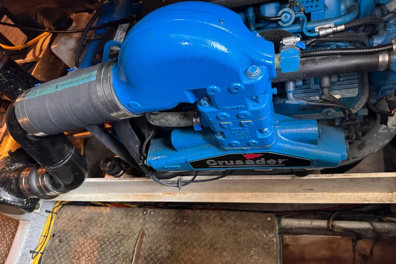 Slide: The Image of Engine compartment of a 2004 Silverton 38 Convertible with a blue Crusader engine. - 50