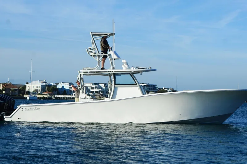 Slide: The Image of 2025 Onslow Bay 41 Tournament boat cruising on calm waters. - 10