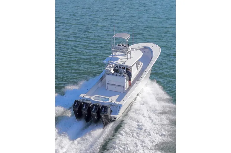 Slide: The Image of 2025 Onslow Bay 41 Tournament boat cruising on open water, rear view. - 12