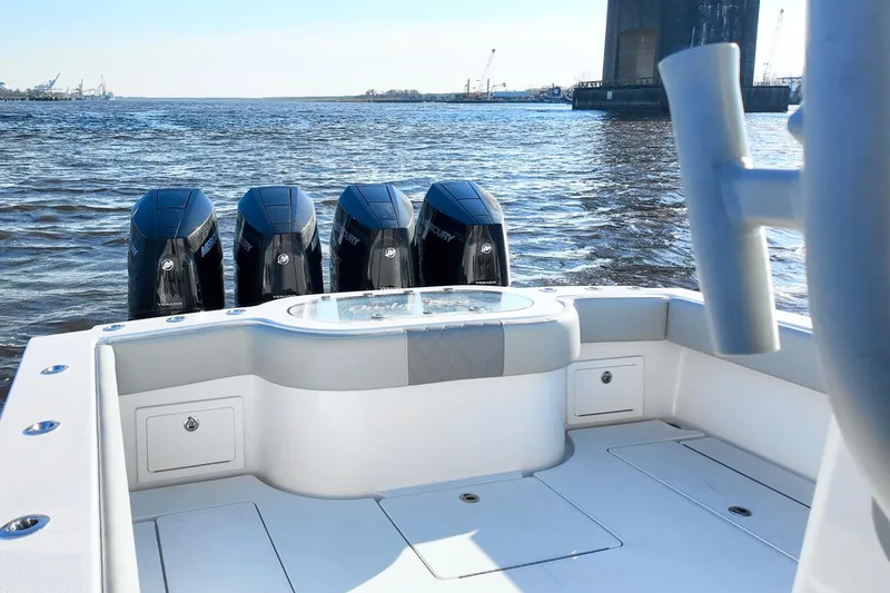 Slide: The Image of 2025 Onslow Bay 41 Tournament boat with four powerful outboard engines on the water. - 15