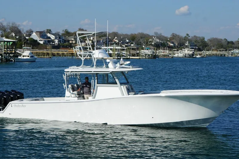 Slide: The Image of 2025 Onslow Bay 41 Tournament boat with four powerful engines on the water. - 2