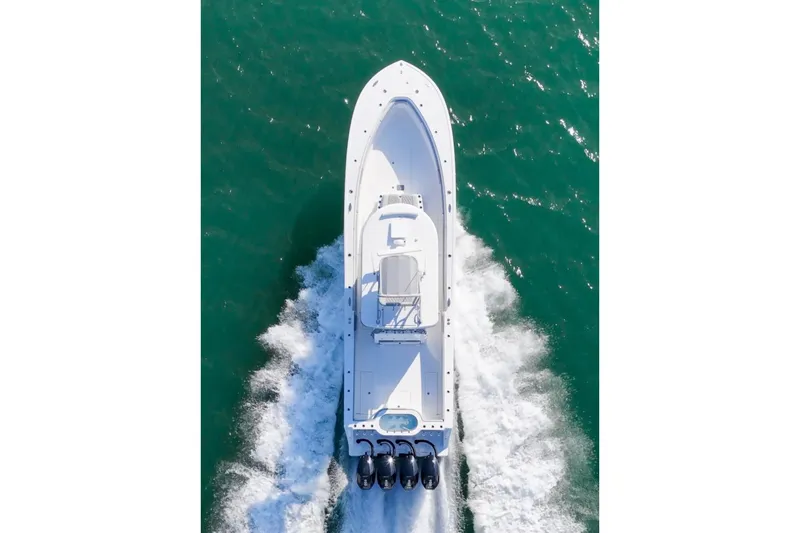 Slide: The Image of Aerial view of 2025 Onslow Bay 41 Tournament boat cruising on open water. - 13
