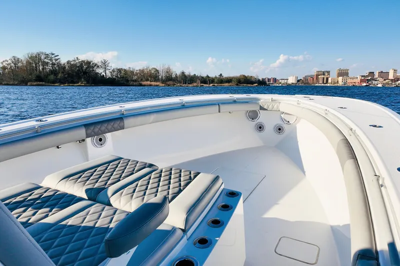 Slide: The Image of 2025 Onslow Bay 41 Tournament boat interior with quilted seating on a sunny day. - 16