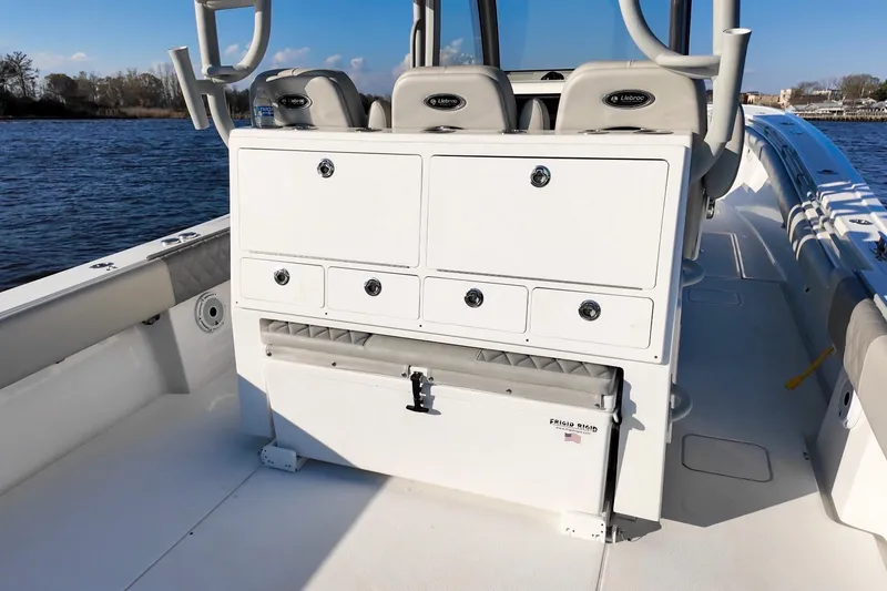 Slide: The Image of 2025 Onslow Bay 41 Tournament boat interior with storage compartments and seating. - 19