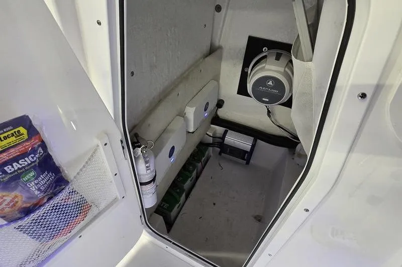 Slide: The Image of Interior of 2025 Sea Hunt BX 25 FS boat with storage and equipment. - 16