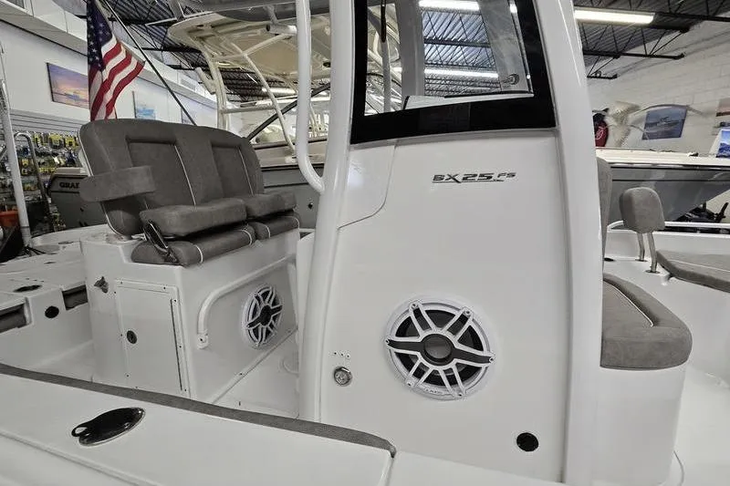 Slide: The Image of 2025 Sea Hunt BX 25 FS boat interior with seating and speaker system. - 4