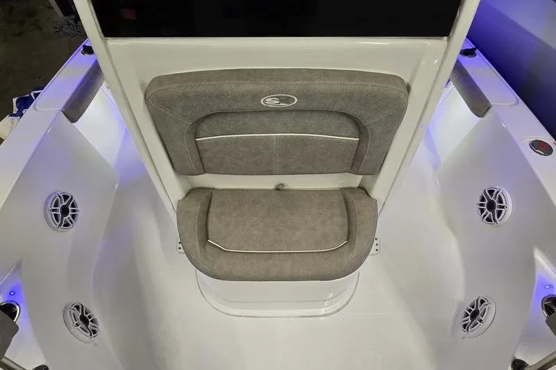 Slide: The Image of 2025 Sea Hunt BX 25 FS boat interior with cushioned seating and built-in speakers. - 6