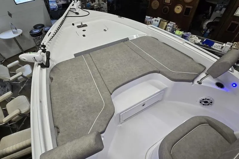 Slide: The Image of 2025 Sea Hunt BX 25 FS boat interior with cushioned seating and storage compartments. - 8