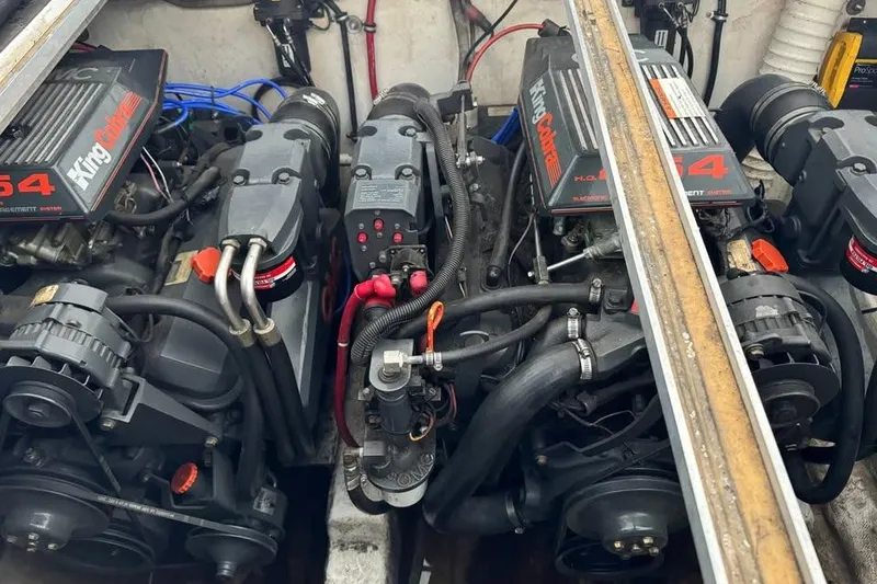 Slide: The Image of 1994 Chris-Craft 322 Crowne engine compartment with dual King Cobra engines. - 12