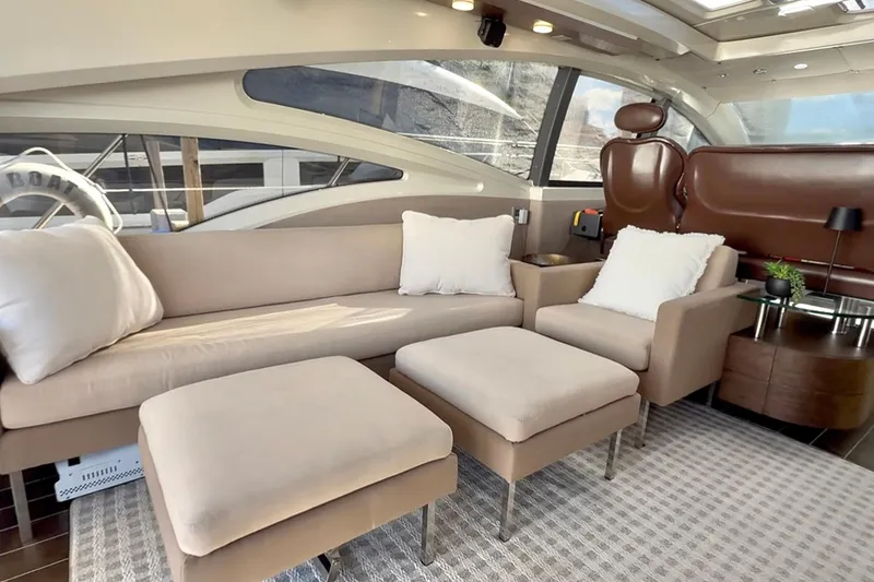Slide: The Image of Luxurious interior of 2011 Azimut 68S yacht with beige seating and modern decor. - 13