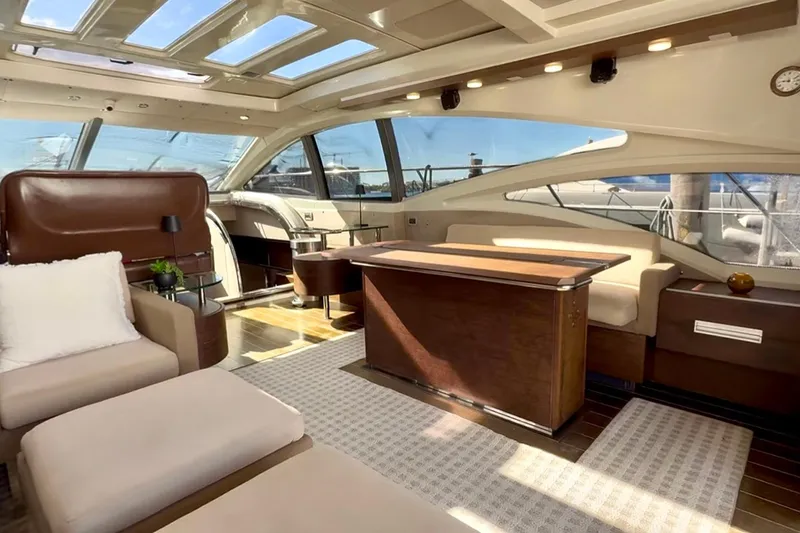 Slide: The Image of Luxurious interior of 2011 Azimut 68S yacht with elegant seating and panoramic windows. - 16