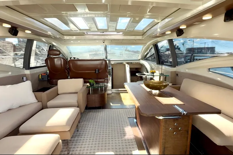 Slide: The Image of Luxurious interior of 2011 Azimut 68S yacht with elegant seating and panoramic windows. - 14