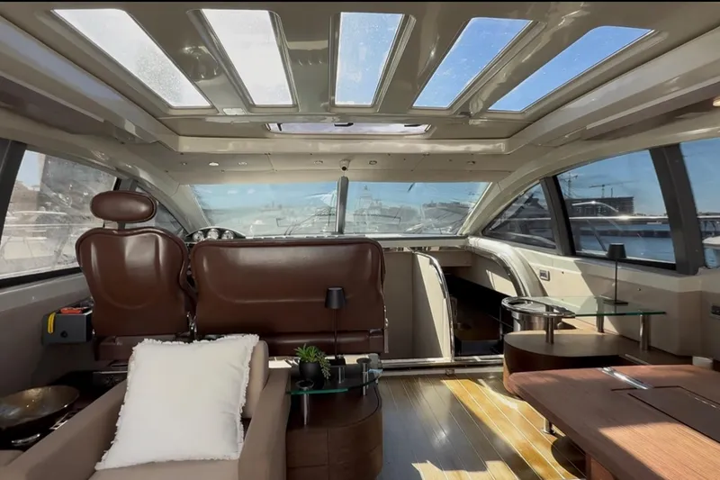 Slide: The Image of Luxurious interior of 2011 Azimut 68S yacht with panoramic windows and elegant seating. - 12