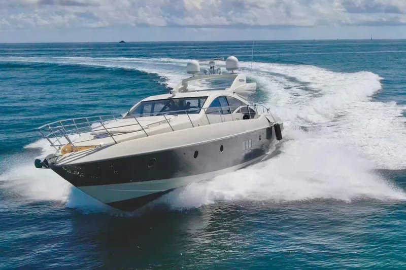 Slide: The Image of Luxury 2011 Azimut 68S yacht cruising on open water, creating a dynamic wake. - 0