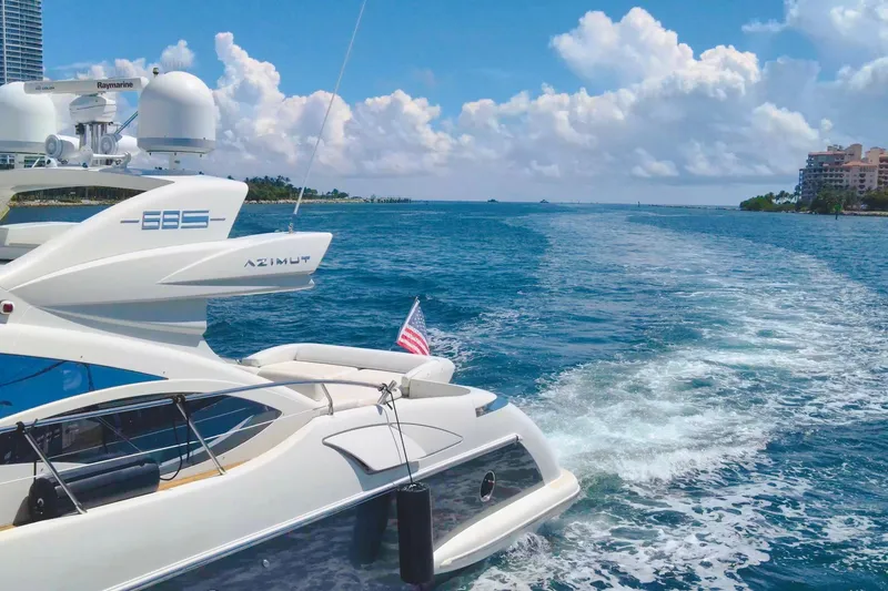 Slide: The Image of 2011 Azimut 68S yacht cruising on a sunny day with blue skies and ocean. - 6