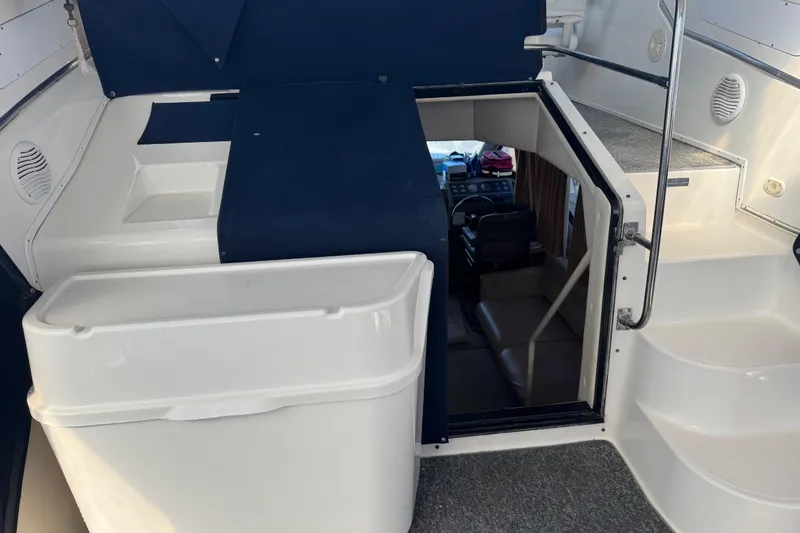 Slide: The Image of 1998 Bayliner 4087 Aft Cabin Motoryacht interior with stairs and helm view. - 10