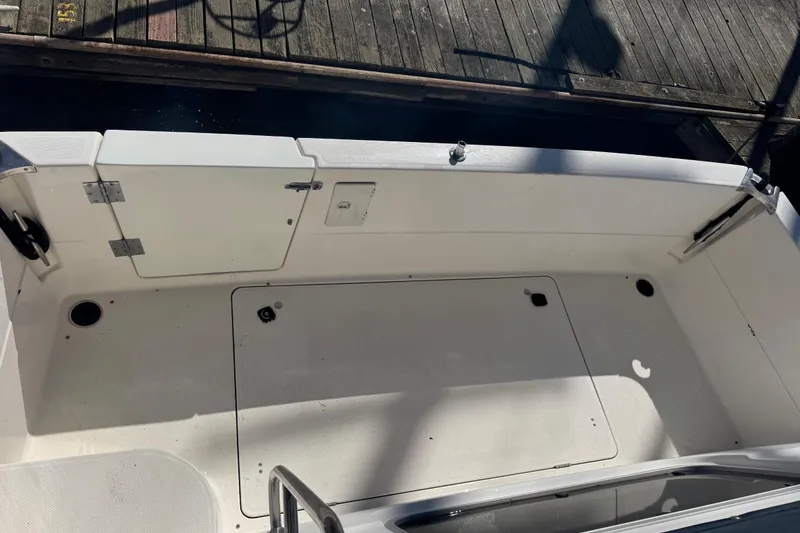 Slide: The Image of 1998 Bayliner 4087 Aft Cabin Motoryacht deck view, featuring clean white surfaces. - 11