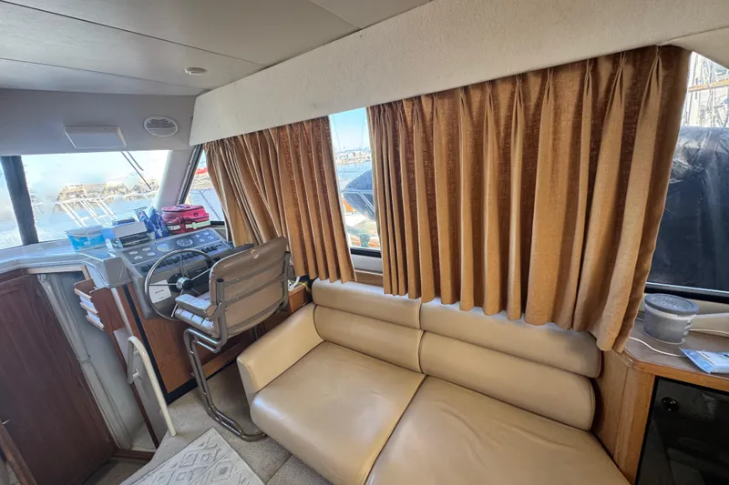 Slide: The Image of Interior of 1998 Bayliner 4087 Aft Cabin Motoryacht with helm and seating area. - 19