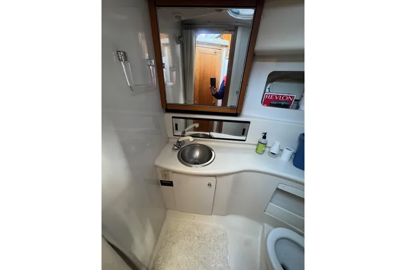 Slide: The Image of Bathroom interior of 1998 Bayliner 4087 Aft Cabin Motoryacht with sink and mirror. - 21