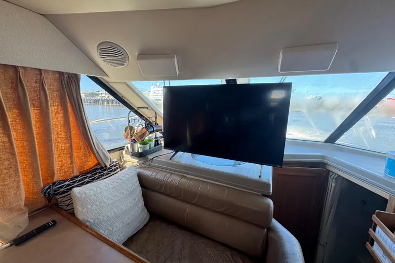 Slide: The Image of Interior of 1998 Bayliner 4087 Aft Cabin Motoryacht with TV and cozy seating area. - 23