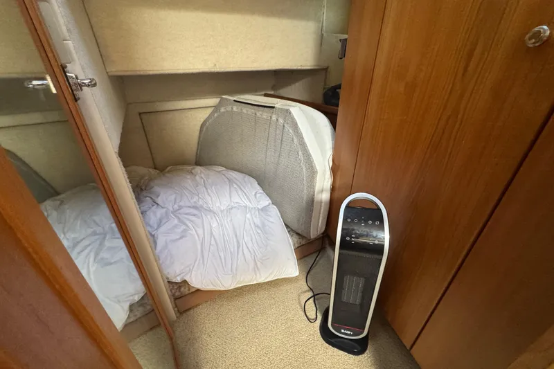 Slide: The Image of Cozy cabin interior of 1998 Bayliner 4087 Aft Cabin Motoryacht with heater and bedding. - 28