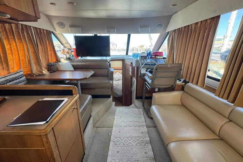 Slide: The Image of Interior of 1998 Bayliner 4087 Aft Cabin Motoryacht with seating, helm, and dining area. - 31