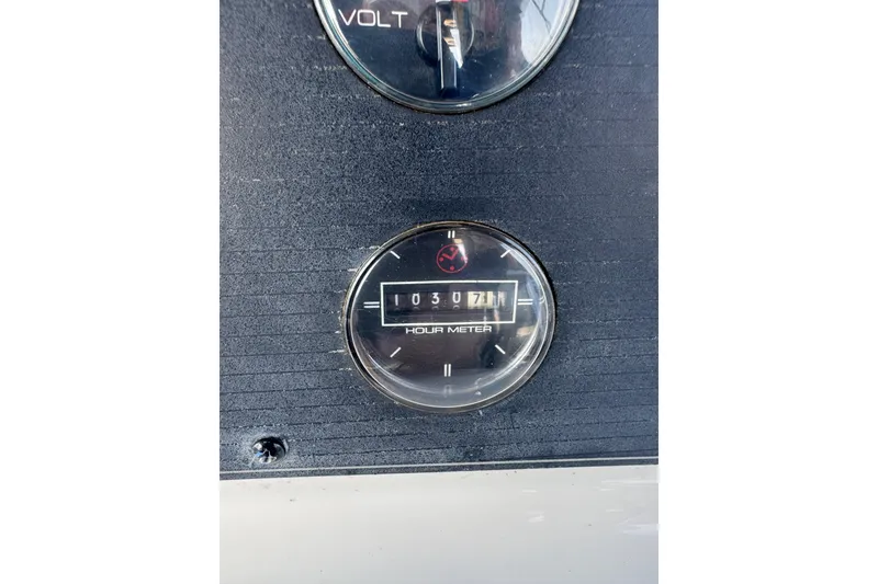 Slide: The Image of Hour meter on 1998 Bayliner 4087 Aft Cabin Motoryacht dashboard, showing 307 hours. - 7