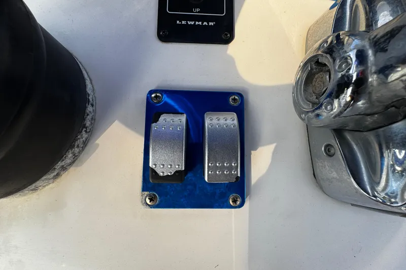 Slide: The Image of Boat control panel with Lewmar switches on a 2012 Renegade 32 CC. - 13