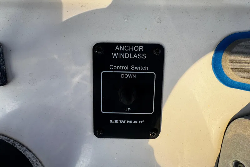 Slide: The Image of Anchor windlass control switch on 2012 Renegade 32 CC boat dashboard. - 14