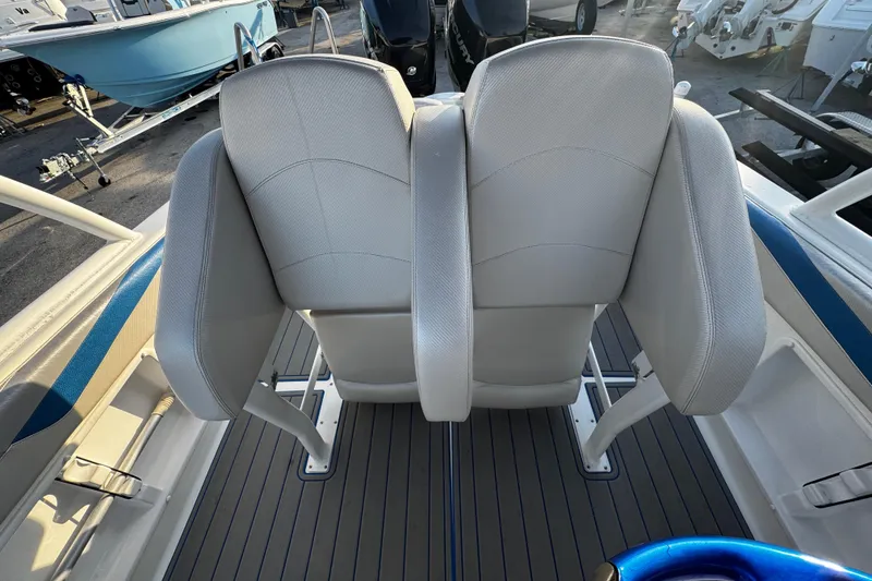 Slide: The Image of 2012 Renegade 32 CC boat interior with dual seats and sleek design. - 6