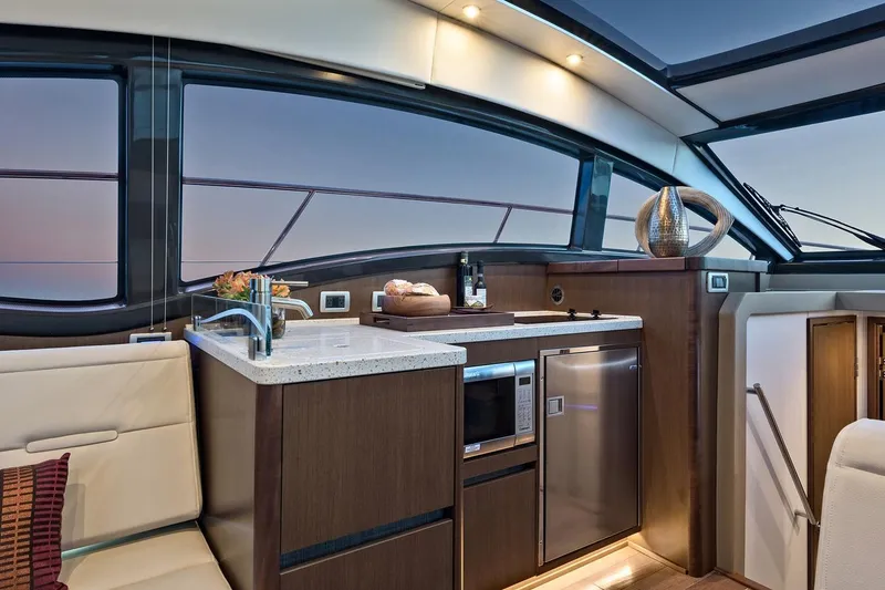 Slide: The Image of Manufacturer Provided Image: 2018 Sea Ray Fly 400 yacht interior kitchen with modern appliances and sleek design. - 12