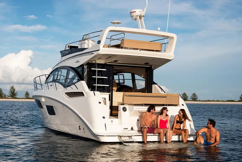 Slide: The Image of Manufacturer Provided Image: 2018 Sea Ray Fly 400 yacht with people enjoying the water. - 6