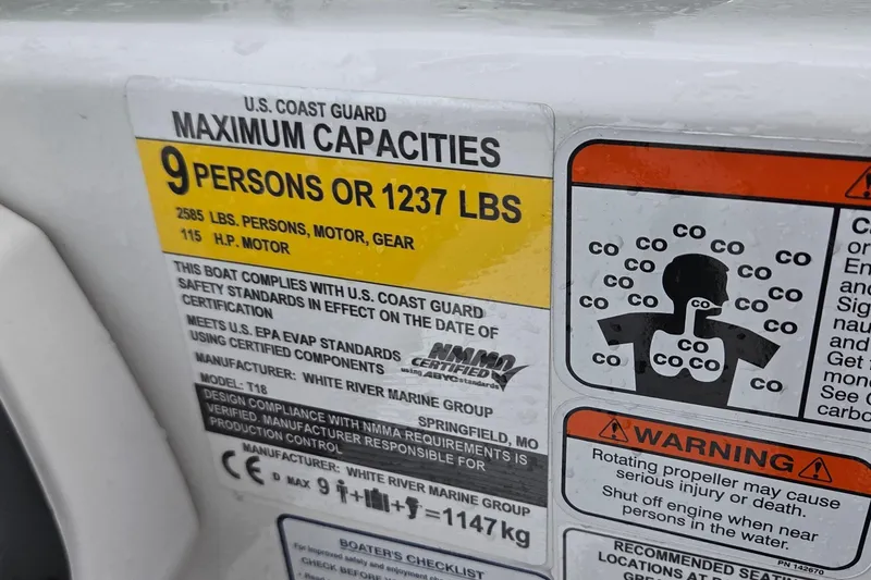 Slide: The Image of Boat capacity label for 2025 Tahoe T18, max 9 persons or 1237 lbs, safety warnings included. - 11
