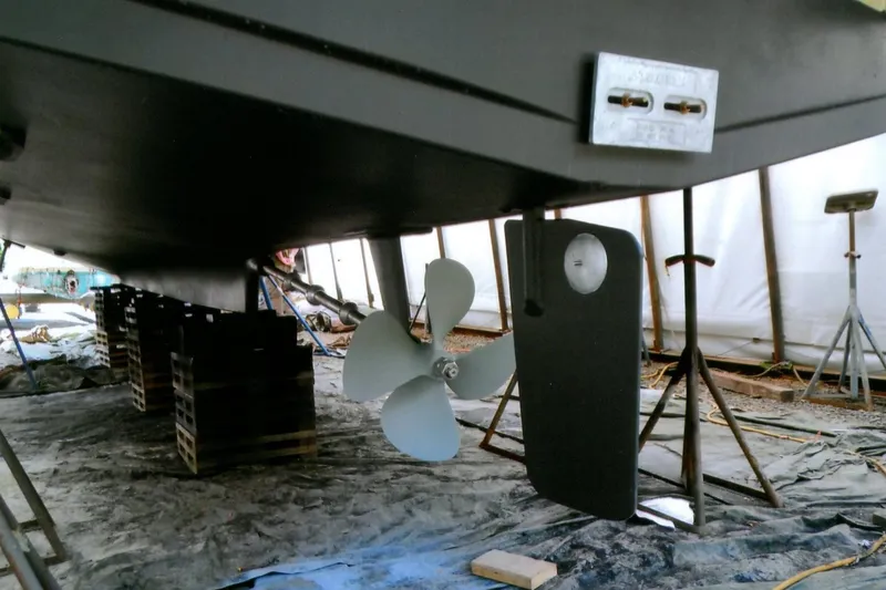 Slide: The Image of Underwater view of 1986 Custom Lynnwood Flybridge Sedan's propeller and rudder in dry dock. - 102