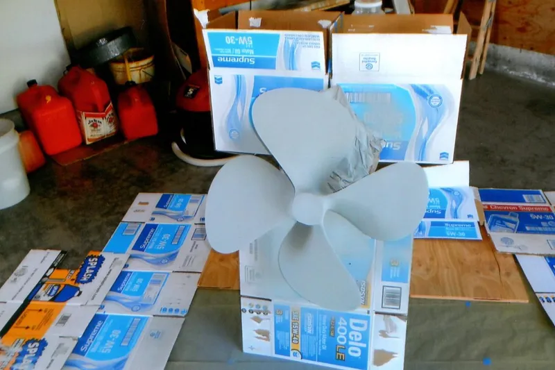 Slide: The Image of Propeller of 1986 Custom Lynnwood Flybridge Sedan in a workshop setting. - 104