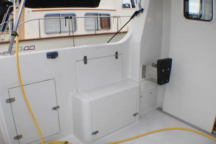 Slide: The Image of 1986 Lynnwood Flybridge Sedan boat interior with storage compartments and clean white surfaces. - 23