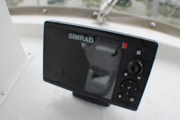 Slide: The Image of Simrad marine navigation device on 1986 Lynnwood Flybridge Sedan boat. - 33