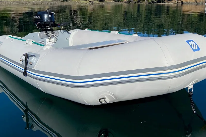 Slide: The Image of Inflatable boat with Suzuki motor on calm water, 1986 Lynnwood Flybridge Sedan. - 39