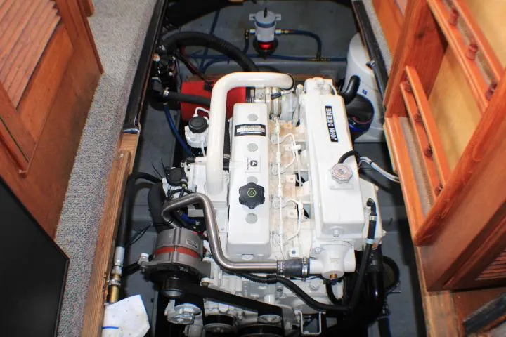 Slide: The Image of 1986 Lynnwood Flybridge Sedan engine compartment with detailed view of the marine engine. - 53