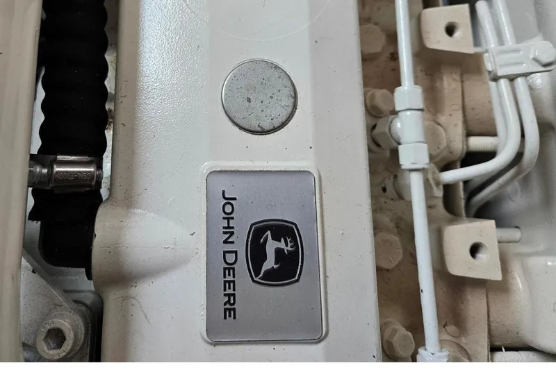 Slide: The Image of Engine detail of a 1986 Lynnwood Flybridge Sedan with John Deere branding. - 56