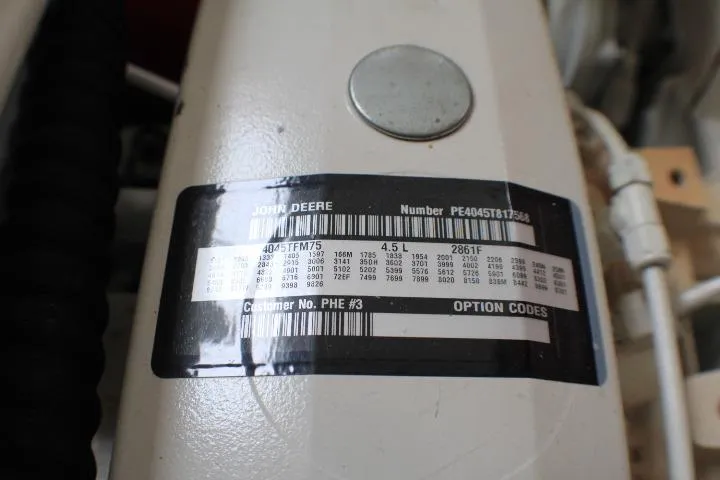 Slide: The Image of Engine label on a 1986 Lynnwood Flybridge Sedan, featuring John Deere specifications. - 57