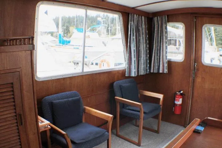 Slide: The Image of Interior of 1986 Lynnwood Flybridge Sedan with wooden paneling and seating. - 76