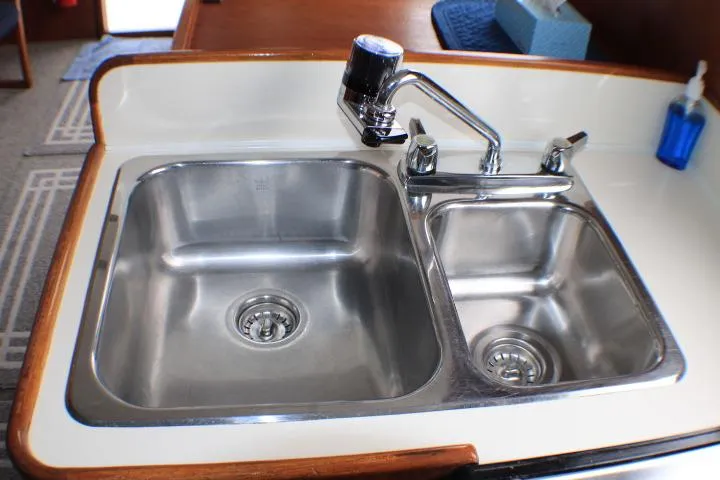 Slide: The Image of Stainless steel double sink in 1986 Lynnwood Flybridge Sedan boat kitchen. - 80